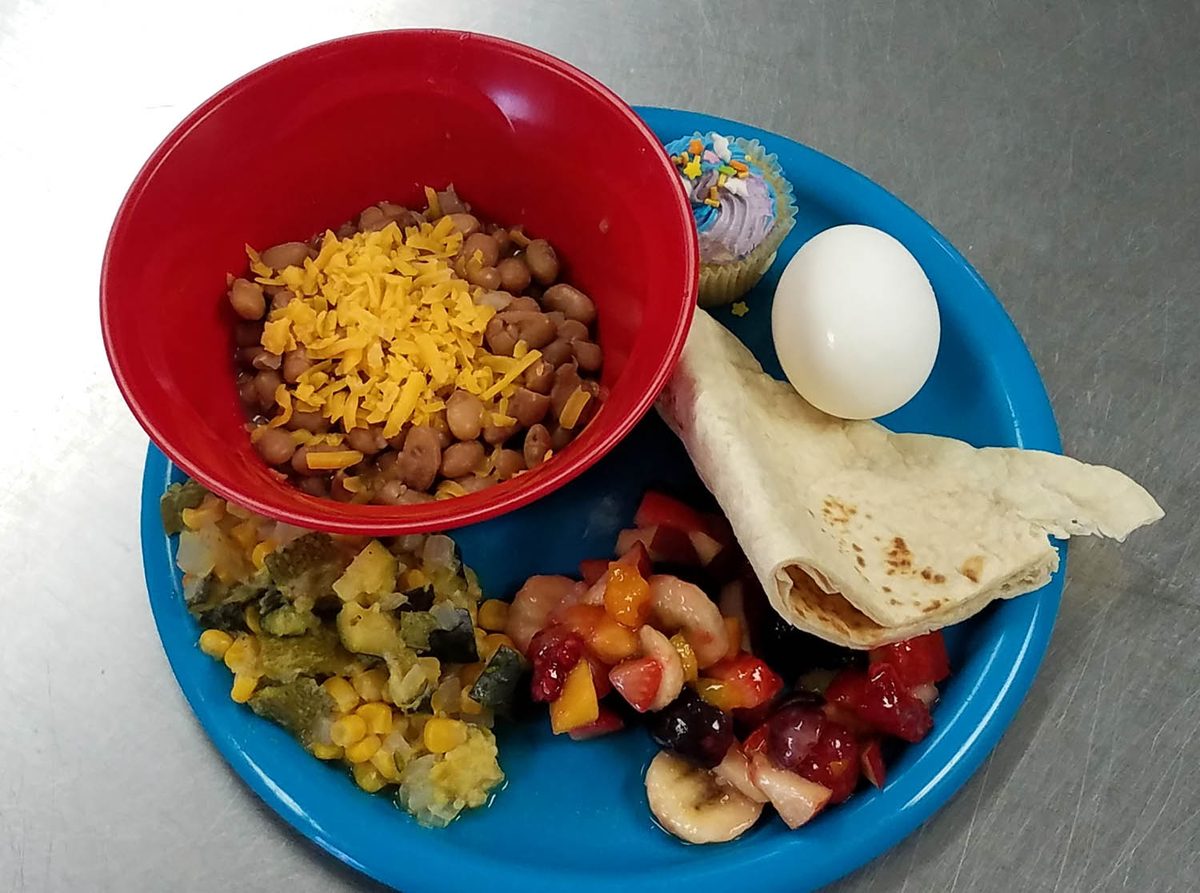 A prepared takeout meal served by Comedor de San Pascual volunteers